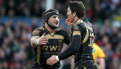 Marty Holah and James Hook celebrate a score during the Ospreys' victory at Ravenhill