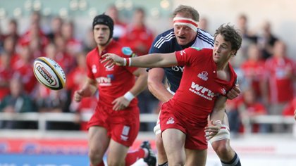 Martin Roberts gets the ball away against Munster