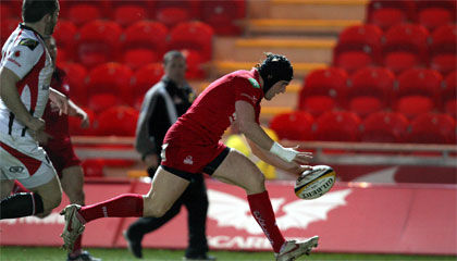 Scarlets winger Andy Fenby gets over for an early try