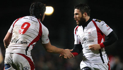 Isaac Boss congratulates Ian Humphreys after a successful penalty kick