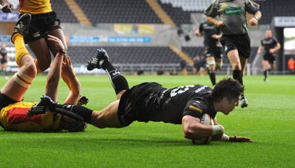Centre James Hook dives over for the opening try