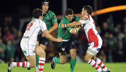 Connacht centre Keith Matthews is tackled by Ulster's Ian Whitten and Paddy Wallace