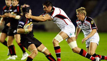 Edinburgh flanker Ross Rennie is tackled by Ulster's Ryan Caldwell