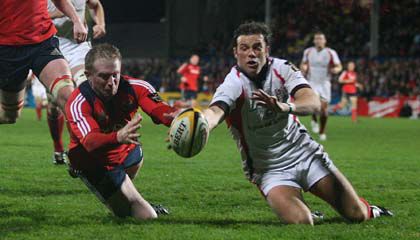 Anthony Horgan and Bryn Cunningham compete for possession