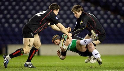 Connacht's Mel Deane is stopped by Edinburgh duo Nick De Luca and Phil Godman