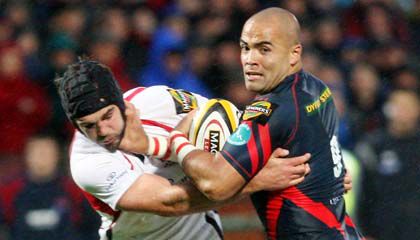 Llanelli scrum half Sililo Martens is tackled by Ulster's Matt McCullough